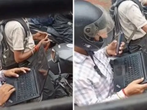 Dân mạng tranh cãi cảnh mở laptop làm việc khi dừng đèn đỏ